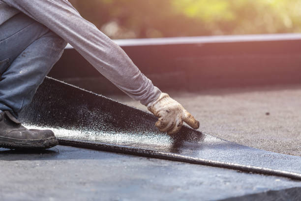 Professional Emergency Waterproofing technician working in Manly, IA